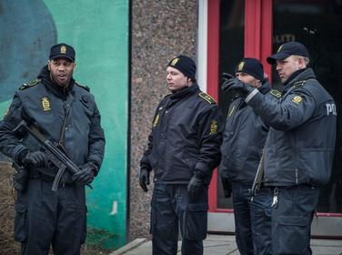 Danish police search an apartment block in Ishoej, Denmark, for people suspected of having been recruited by the Islamic State, April 7, 2016
