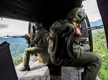 Venezuelan soldiers patrol during a military operation to destroy clandestine drug laboratories in Zulia, Venezuela, near the border with Colombia, December 6, 2014