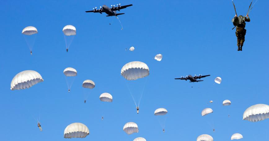 Paratroopers jumping out of a plane