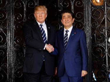 U.S. President Donald Trump greets Japan's Prime Minister Shinzo Abe prior to their bilateral meeting at Trump s Mar-a-Lago estate in Palm Beach, Florida U.S., April 17, 2018