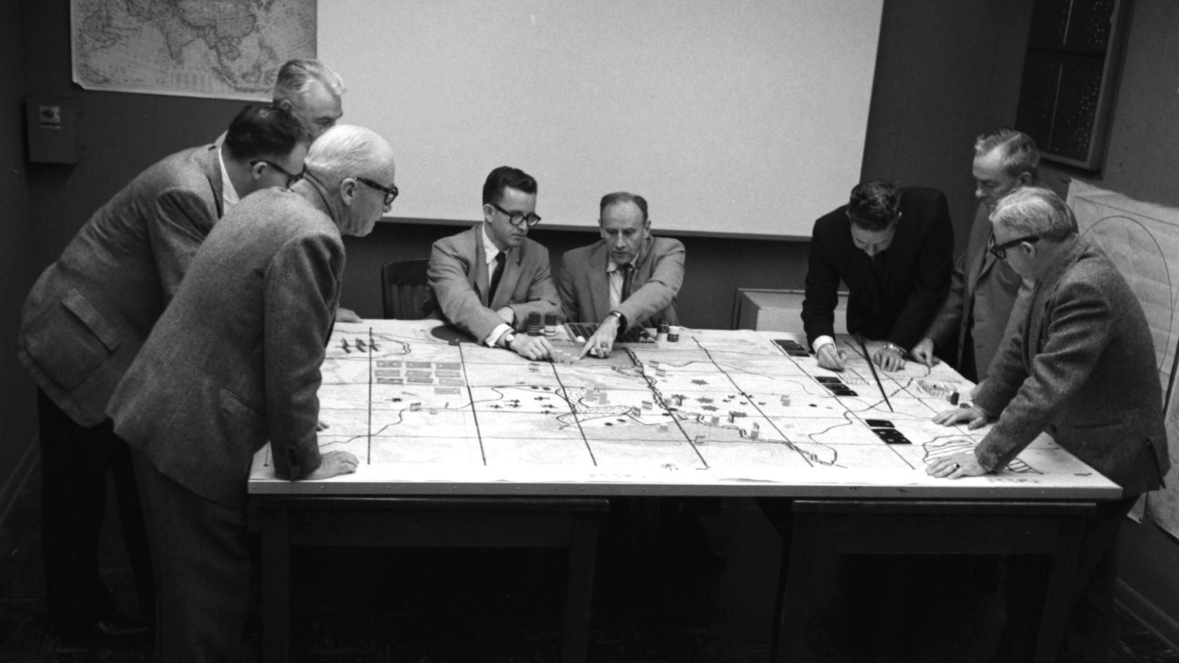 Engineering Operations game, 1966, with Milton Weiner (3rd from right), Olaf Helmer (2nd from right), and others