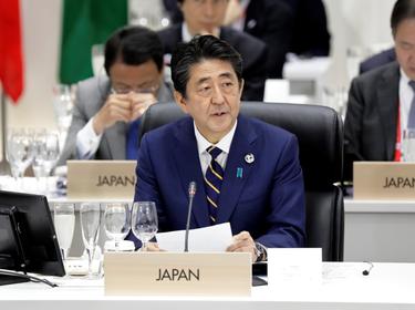 Japan's Prime Minister Shinzo Abe speaks during a working lunch at the Group of 20 (G-20) summit in Osaka, Japan, on Friday, June 28, 2019, photo by Kiyoshi Ota/Reuters