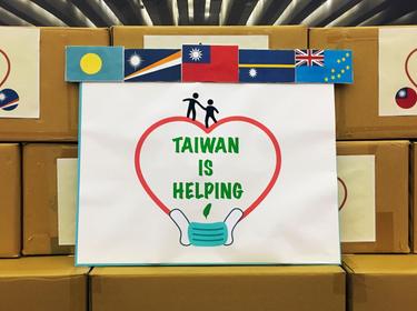 A sign with flags of (R-L) Tuvalu, Nauru, Taiwan, Marshall Islands, and Palau is seen before a ceremony to donate masks to Taiwan's Pacific allies, in Taipei, Taiwan, April 15, 2020, photo by Ben Blanchard/Reuters