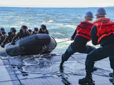 U.S. Navy sailors pull a line affixed to a combat rubber raiding craft with Japan Ground Self-Defense Force Amphibious Rapid Deployment Regiment soldiers in the Pacific Ocean, February 6, 2020, photo by Mass Communication Specialist 2nd Class Natalie M. Byers/U.S. Navy