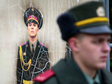 A recruit from the presidential regiment waits for a ceremony to take the oath at a military base in Kiev, Ukraine, November 16, 2013, photo by Gleb Garanich/Reuters