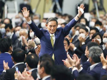 Japanese Chief Cabinet Secretary Yoshihide Suga gestures as he is elected as new head of Japan's ruling party paving the way for him to replace Prime Minister Shinzo Abe, in Tokyo, Japan, September 14, 2020, photo by KYODO/Reuters