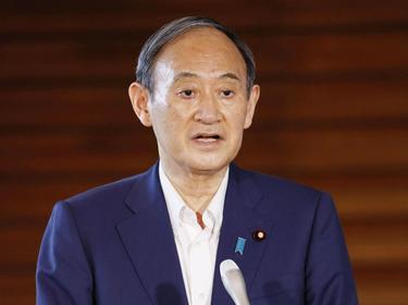 Japan's Prime Minister Yoshihide Suga speaks to media after announcing his withdrawal from the party leadership race in Tokyo, Japan, September 3, 2021, photo by Kyodo/Reuters