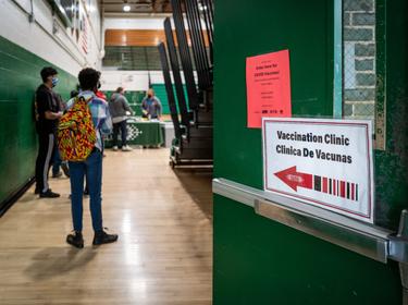 Signs on a door to a school gym point students to wait in line to receive COVID-19 vaccinations. Photo by Phil Roeder/Flickr
