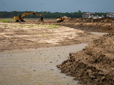 Construction at a subdivision for residents of Isle de Jean Charles, Louisiana, who are being relocated due to climate change, near Shriever, Louisiana, April 7, 2021, photo by Kathleen Flynn/Reuters