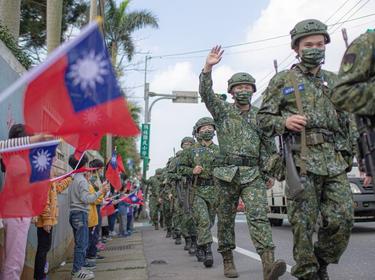 Taiwanese soldiers walk down a street in this undated photo posted to Twitter on March 11, 2022 by Taiwanese President Tsai Ing-wen, photo courtesy of the Office of the President of Taiwan