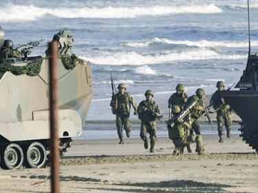 Japanese Ground Self-Defense Force amphibious rapid deployment unit conducts a drill on Tanegashima Island, November 25, 2021, photo  by Kyodo via Reuters Connect