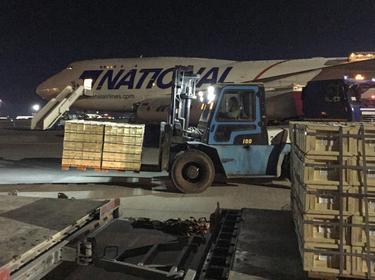 Military aid from the United States is unloaded from a plane at the Boryspil International Airport outside Kyiv, Ukraine, February 13, 2022, photo by Serhiy Takhmazov/Reuters