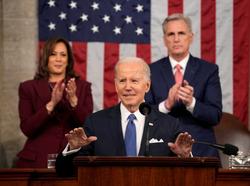 President Joe Biden delivers the State of the Union address as Vice President Kamala Harris and House Speaker Kevin McCarthy applaud, February 7, 2023, photo by Jacquelyn Martin/Pool via Reuters