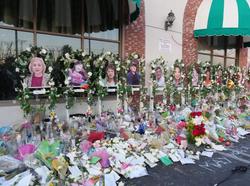 Photos of mass shooting victims at a memorial outside the Star Ballroom Dance Studio in Monterey Park, California, January 31, 2023, photo by Image of Sport/Sipa USA vie Reuters