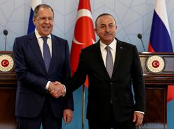Russian Foreign Minister Sergei Lavrov and Turkish Foreign Minister Mevlut Cavusoglu shake hands at a meeting in Ankara, Turkey, June 8, 2022, photo by Umit Bektas/Reuters