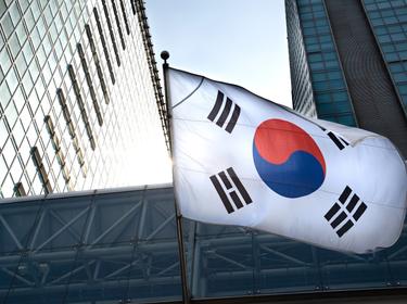 The Korean flag hanging in a high-rise building, photo by Jae Young Ju/Getty Images