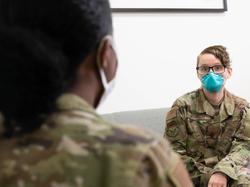 Maj. Laura Johnson, a mental health flight commander, speaks to an Airman in her office on June 10, 2021, at Malmstrom Air Force Base, Montana, photo by Heather Heiney/U.S. Air Force