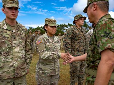 Commanding General of the Japan Ground Self-Defense Force awards U.S. Marines and Soldiers a challenge coin during an award ceremony in Okinawa, Japan, February 2019, photo by Joshua Sechser/U.S. Department of Defense, Commanding General of the Japan Ground Self-Defense Force awards