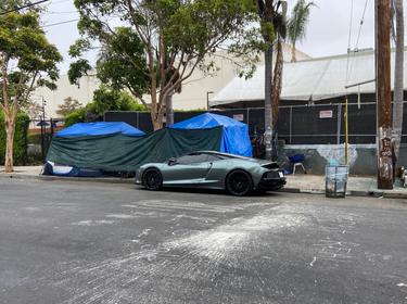 A Lamborghini outside of a tent in Venice, California, photo by Jason Ward/RAND Corporation
