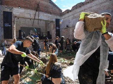 Volunteers remove debris from the House of Culture in the village of Ivanivka, which was damaged in a Russian attack, in Chernihiv region, Ukraine, September 3, 2022, photo by Vladislav Musienko/Reuters