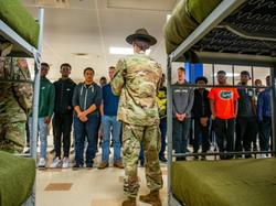 Potential U.S. Army recruits listen to a drill sergeant talk about barracks life and other aspects of undergoing Army basic training at Fort Benning, Georgia, October 26, 2019, photo by U.S. Army
