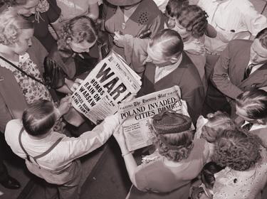 Americans gather to read headlines about the German invasion of Poland that triggered World War II, September 1, 1939, photo by Everett Collection/Alamy 