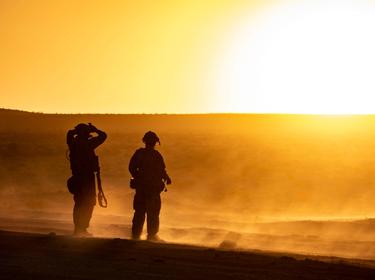Soldiers look out over the National Training Center at Fort Irwin, California, August 17, 2021, photo by Spc. Steven Alger/U.S. Army