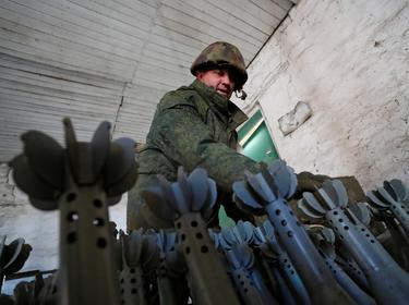 A service member of pro-Russian troops in uniform without insignia at the weapons depot near Marinka, Donetsk Region, Ukraine, March 22, 2022, photo by Alexander Ermochenko/Reuters