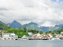 Sitka, Alaska from the water, with mountains in the background, photo by AlexSava/Getty Images
