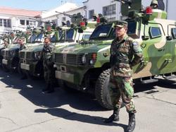 Bolivian soldiers stand next to military vehicles received by Bolivian Armed Forces from the Chinese government in La Paz, Bolivia, July 29, 2016, photo by Bolivian Information Agency/Handout via Reuters