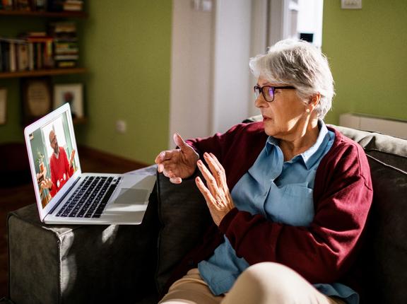 Senior White woman on a video call on her laptop with her therapist, photo. by Geber86/Getty Images